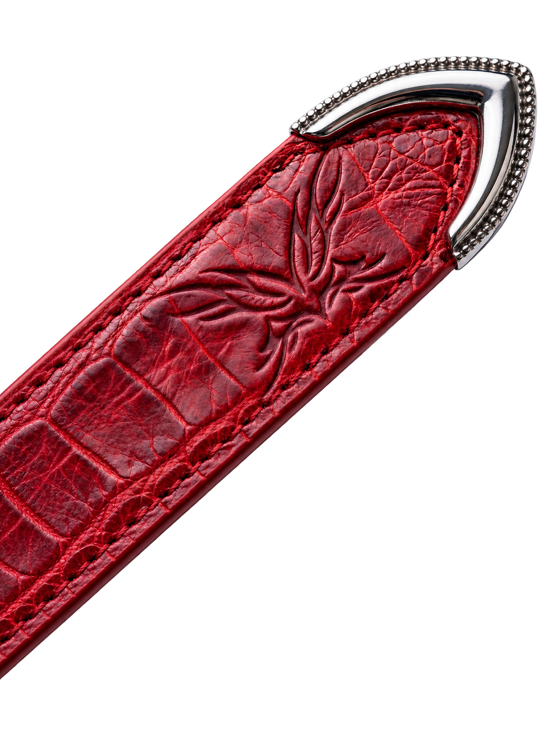 Red croc-embossed belt tip with MOONAERA logo and silver metal detailing